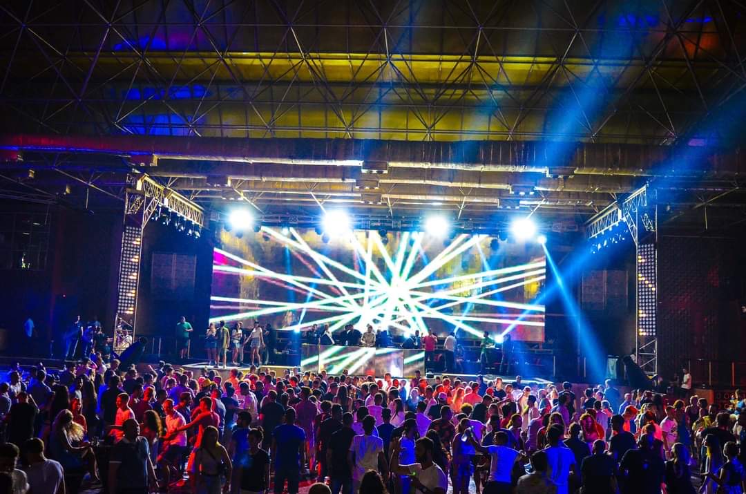 Taj Mahal dance floor facing a brightly lit blue stage